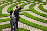 Man and woman looking into maze