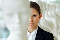 A Woman standing out from mannequins - different personalities - peter barron stark companies