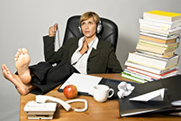 Lazy employee messy desk bored woman Peter Barron Stark Companies