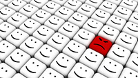 Many Happy faces and one red, sad face