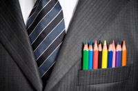 Creative employee with colored pencils in his business suit pocket - Peter Barron Stark Companies