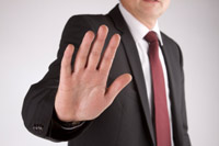 Man holding up his hand to resist change - peter barron stark companies