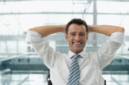 Man looking happy and relaxed in an office - work-life balance