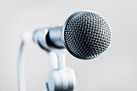 Face your fear of public speaking image of a podium