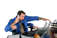 Man multi-tasking at work